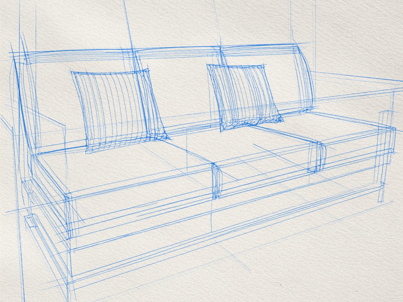 Le croquis au trait bleu d'un sofa modulaire, vu en perspective, sur papier blanc